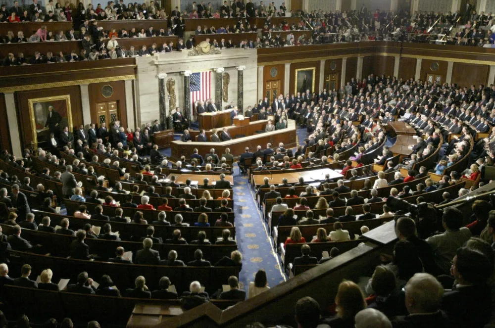 U.S. President George W. Bush delivers his State of the Union address in the House Chamber in Washington February 2, 2005. President Bush told Americans in the State of the Union speech that Social Security must be changed to save it from financial ruin, and that U.S. troops will stay in Iraq until the country's emerging government can defend itself. REUTERS/Jason Reed