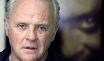 Sir Anthony Hopkins lets out a long, long sigh. "So&nbsp;...," he said. "Are we done'" Hopkins, the Oscar-winning actor who dismisses his work as "just a job," was doing yet another round of interviews, this time to promote two special edition DVDs of his most infamous screen creation -- the spine-chilling, flesh-eating gourmet Hannibal Lecter. Hopkins has long been a major player in the less-is-more school of acting, stealing a scene with silence or an unblinking blue-eyed stare. At 63, he has reached a state of relaxed detachment in tune with the mellow music of his Welsh voice. Hopkins poses for his upcoming release of "The Silence of the Lambs" and "Hannibal" DVDs, July 17, 2001 in Santa Monica. Both DVDs are scheduled to be released on August 21, 2001 in the United States.   REUTERS/Adrees Latif/FEATURE-LEISURE-HOPKINS