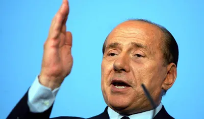  Italian Prime Minister Silvio Berlusconi speaks at a joint news conference with British Prime Minister Tony Blair, at Lancaster House in London, Tuesday July 13, 2004. Blair declined to comment on the Butler report into the intelligence that led Britain into the war with Iraq, which is due to be released to the public on July 1, but denied that the decision was based on "duff intelligence".(AP Photo/David Bebber, pool)