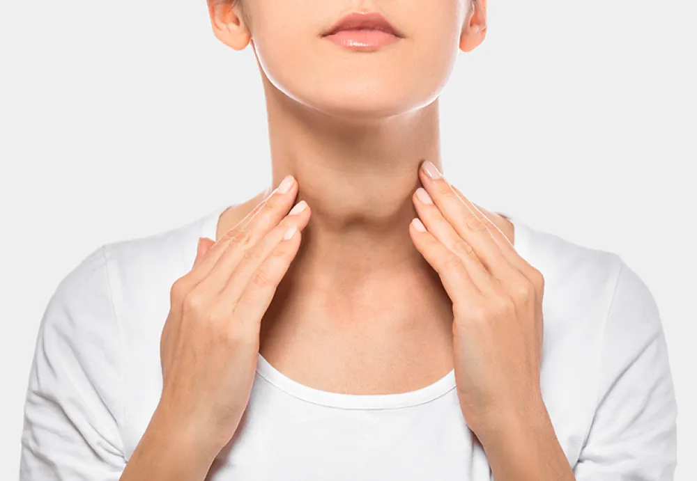 Woman palpation her neck, examine thyroid gland. Enlarged thyroid gland, close up. Medical ultrasound diagnostics of the thyroid gland on background