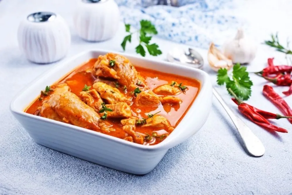 Traditional Indian dish chicken. Spicy chicken curry in bowl 