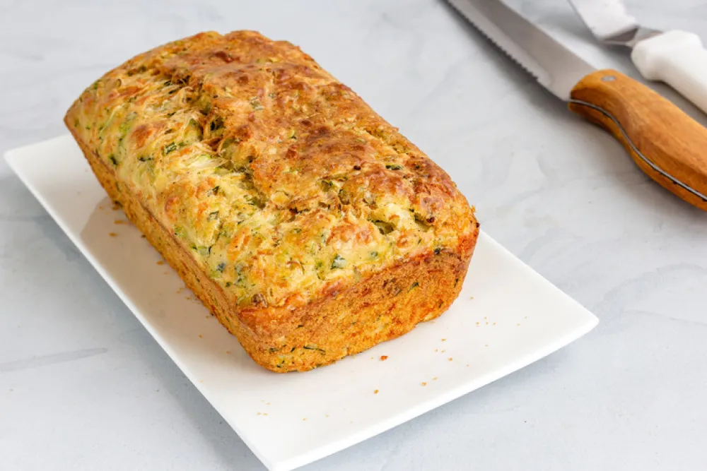 Zucchini Bread Loaf on a Plate on White Background, Healthy Food Photography