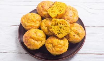 Homemade baked muffins with cheese and eggs. Food background