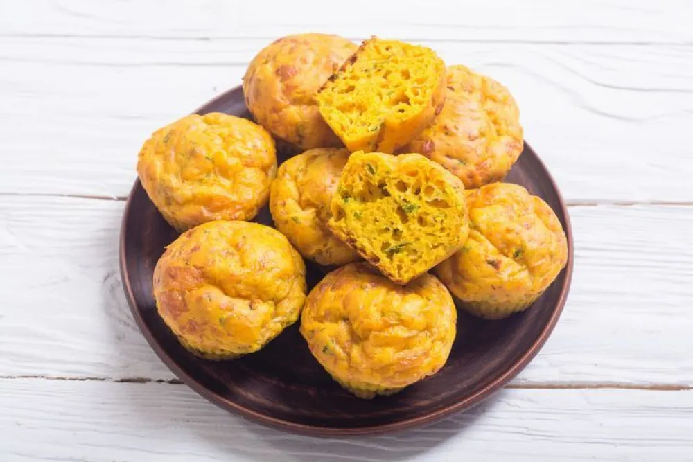 Homemade baked muffins with cheese and eggs. Food background