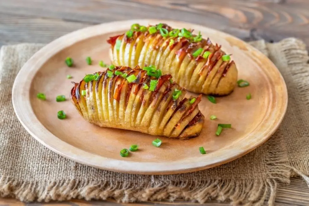 Hasselback potatoes on a plate