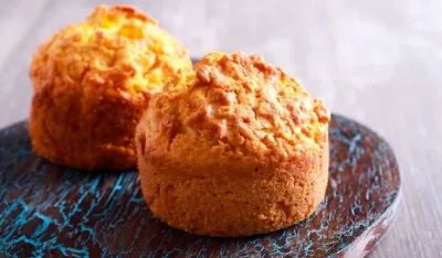Homemade muffins on painted board, selective focus