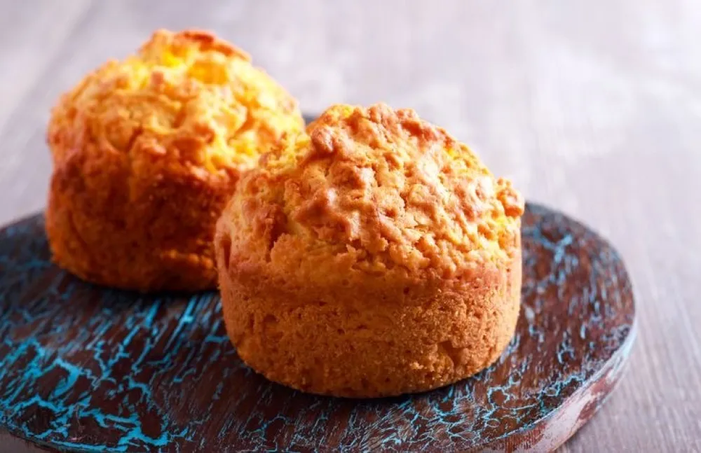 Homemade muffins on painted board, selective focus