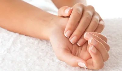 Beautiful hands on the white towel
