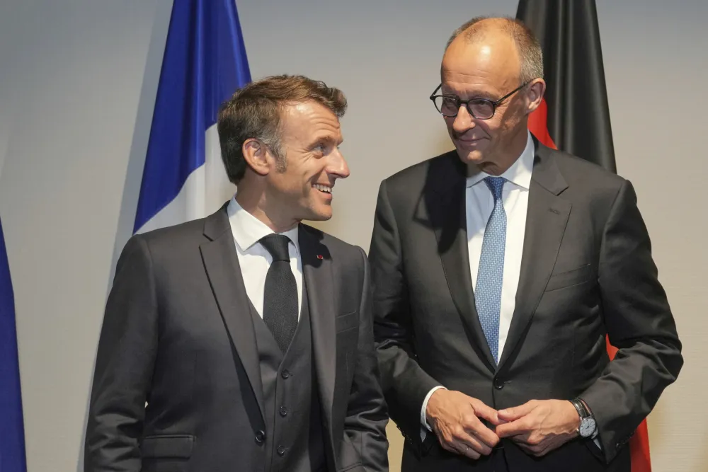 Emanuel Makron i Fridrih Merc